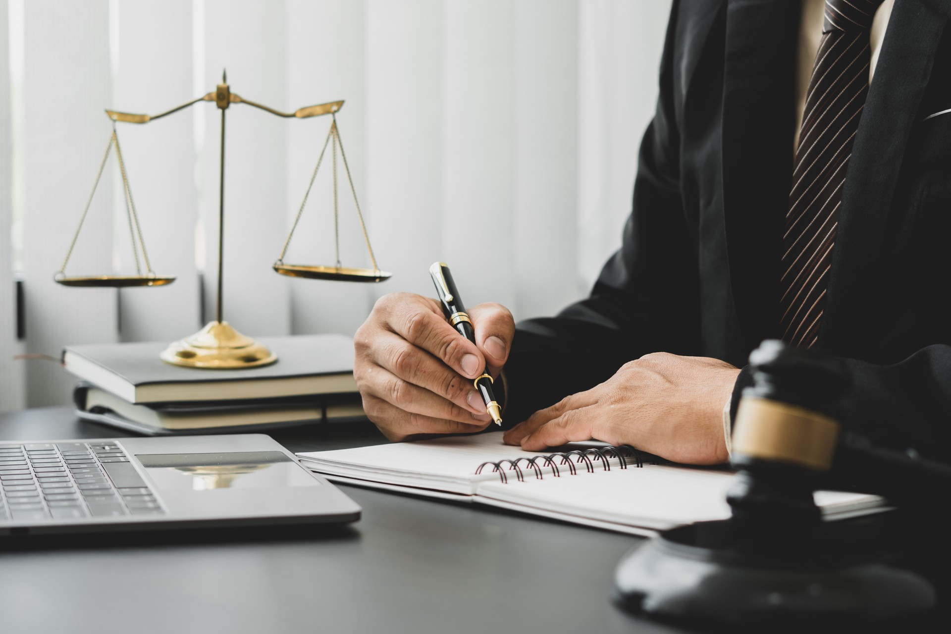 Attorneys or judges sitting at work to sign important documents, attorneys and law, legal concepts of the judiciary and the legislature.